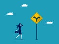 Career direction or business direction. Businesswoman making decisions on a direction arrow sign