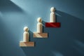 Career growth. Career development. Goal achievement. Career path. Wooden figure placed in increasing order on red block