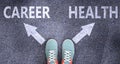 Career and health as different choices in life - pictured as words Career, health on a road to symbolize making decision and