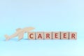 Career launch and take off concept. Wooden airplane with career word in blocks. Royalty Free Stock Photo