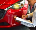 career man saleman business inspection writing on notepad or book, paper with car blurry background.for transport automobile autom