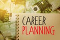 Career planning word written on copybook sheet, put on 100 euro bills. Ambitious goals in education and job with competitive