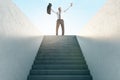 Career success concept with happy businessman on top of stairway on sky background Royalty Free Stock Photo