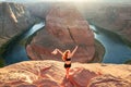 Carefree american woman on Grand canyon. Young Woman enjoying view of Horseshoe bend. Adventure active vacations outdoor Royalty Free Stock Photo