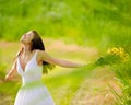 Carefree attractive girl in field