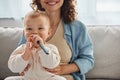 carefree baby chewing teething toy near Royalty Free Stock Photo