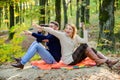 Carefree camping. Family picnic. surprised girl drink mulled wine. bearded man shocked watch with binoculars. Spring Royalty Free Stock Photo