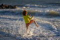 Carefree child running on sea. Happy cute child running near ocean on warm summer day. A Cute little kid boy running and Royalty Free Stock Photo