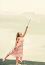 Carefree childhood. small girl with umbrella. rainy weather. Fall mood. autumn weather forecast. autumn fashion. Freedom