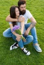 Carefree couple in love cuddling relax in park, tender hug concept