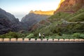 Carefree couple standing on the mountain roadside Royalty Free Stock Photo