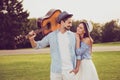 Carefree cute romantic bearded brunet guy in shirt, bonding dreamy lady. Leisure, friends, play music, friendship, chill Royalty Free Stock Photo