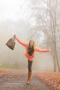 Carefree fashion woman relaxing in autumn park. Royalty Free Stock Photo