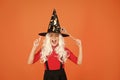 Carefree fun. small girl halloween party. mystery witch do magic. small child witch hat. trick or treat. supernatural