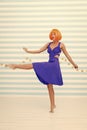 Carefree girl with crazy look makes step. so much fun. crazy girl with orange hair dancing barefoot. totally carefree