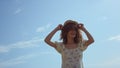 Carefree girl dancing beach in flowery dress close up. Woman have fun on nature. Royalty Free Stock Photo