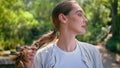 Carefree girl enjoy nature beauty standing green park close up. Woman relaxing