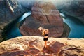 Carefree girl on Grand canyon. Young Woman enjoying view of Horseshoe bend. Travel Lifestyle success motivation concept. Royalty Free Stock Photo