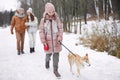 Carefree Girl walking Dog in Winter Park Royalty Free Stock Photo