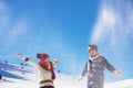 Carefree happy young couple having fun together in snow. Royalty Free Stock Photo