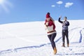 Carefree happy young couple having fun together in snow. Royalty Free Stock Photo