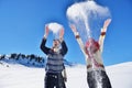 Carefree happy young couple having fun together in snow. Royalty Free Stock Photo