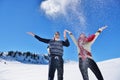 Carefree happy young couple having fun together in snow. Royalty Free Stock Photo