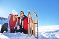 Carefree happy young couple having fun together in snow. Royalty Free Stock Photo