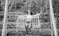 carefree kid swinging outdoor. teen girl having fun on playground. childhood happiness. Royalty Free Stock Photo