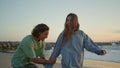 Carefree lovers having fun at sunset beach. Love couple embracing at sea coast Royalty Free Stock Photo