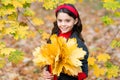 Carefree morning. beauty of nature. kid in autumn park. cheerful girl with yellow maple leaves. happy kid enjoy fall