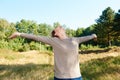 Carefree older woman with arms outstretched Royalty Free Stock Photo