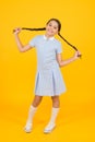 Carefree pupil. small girl in school uniform. retro look. child in vintage style. old school. kid fashion. happy child