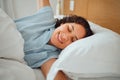 Carefree, rested while stretching in in bed in the morning. Relaxing and enjoying free time while sleeping in. Cozy Royalty Free Stock Photo