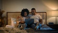 Carefree romantic date happy relaxed family African American married couple using laptop shopping man woman watching Royalty Free Stock Photo