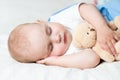 Carefree sleep baby with soft toy Royalty Free Stock Photo