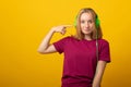 Carefree smiling teen girl listens music in headphones Royalty Free Stock Photo