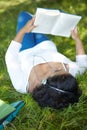 Carefree Student Revising And Listening To Music In Park Royalty Free Stock Photo