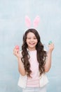 Carefree time. Holiday gifts and presents. Girl with Easter eggs and bunny. Happy easter. Pretty little girl preparing