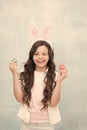 Carefree time. Holiday gifts and presents. Girl with Easter eggs and bunny. Happy easter. Pretty little girl preparing