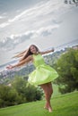 Carefree woman dancing in summer