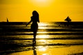 Carefree woman dancing in the sunset on the beach. vacation vita Royalty Free Stock Photo