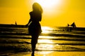 Carefree woman dancing in the sunset on the beach. vacation vita Royalty Free Stock Photo