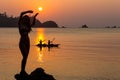 Carefree woman dancing in the sunset on the beach. vacation vitality healthy living concept Royalty Free Stock Photo