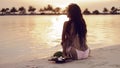 Carefree Woman Enjoying Beautiful Sunset on Tropical Beach. Maldives exotic background