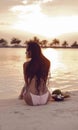 Carefree Woman Enjoying Beautiful Sunset on Tropical Beach. Maldives exotic background