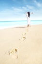 Carefree woman with footprint Royalty Free Stock Photo