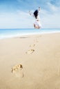 Carefree Woman with footprints Royalty Free Stock Photo