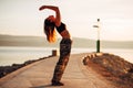 Carefree woman meditating in nature.Finding inner peace.Yoga practice.Spiritual healing lifestyle.Enjoying peace,anti-stress