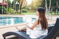 Carefree woman relaxation in swimming pool summer Holiday concept Royalty Free Stock Photo